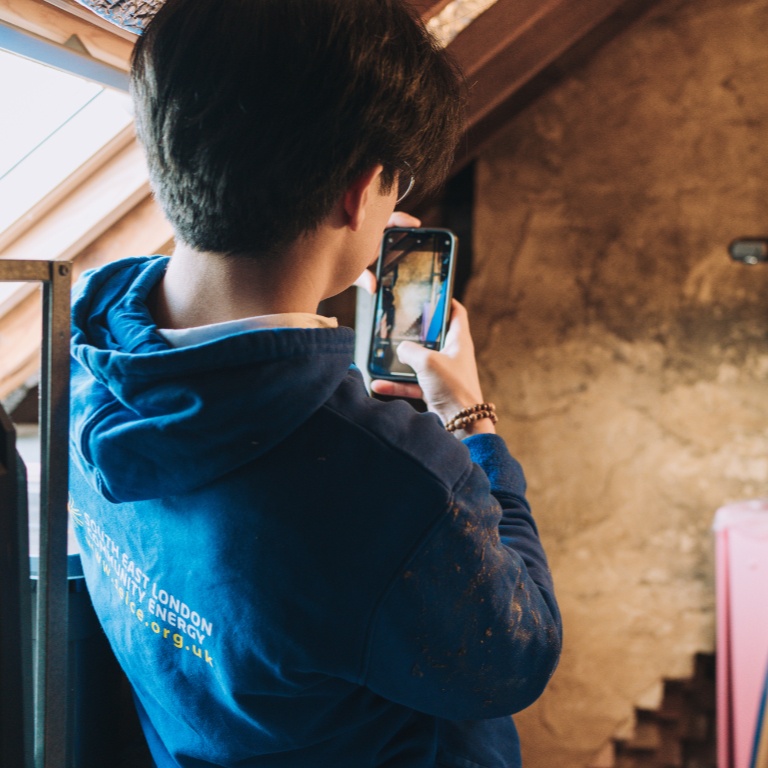 Retrofit assessor taking a photo